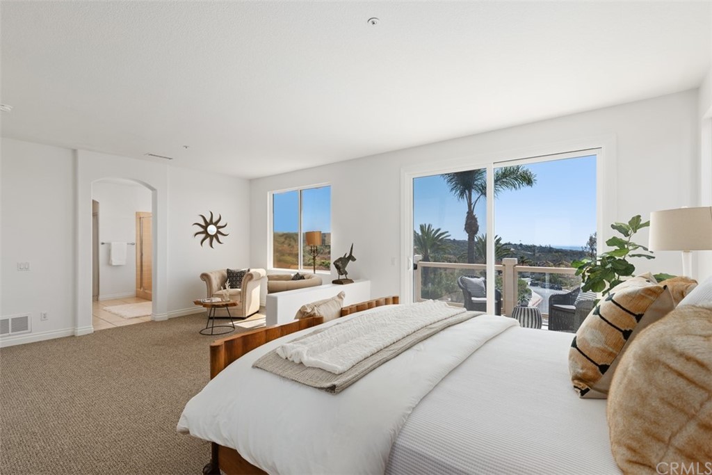 511 Avenida Ossa San Clemente, CA 92672 - Photo 19 of 49 a bedroom with a bed a table and chair