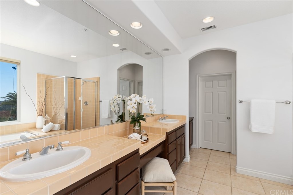 511 Avenida Ossa San Clemente, CA 92672 - Photo 21 of 49 a bathroom with a double vanity sink and a mirror