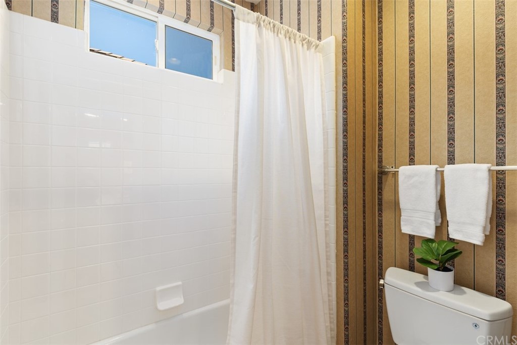 511 Avenida Ossa San Clemente, CA 92672 - Photo 28 of 49 a bathroom with a shower curtain
