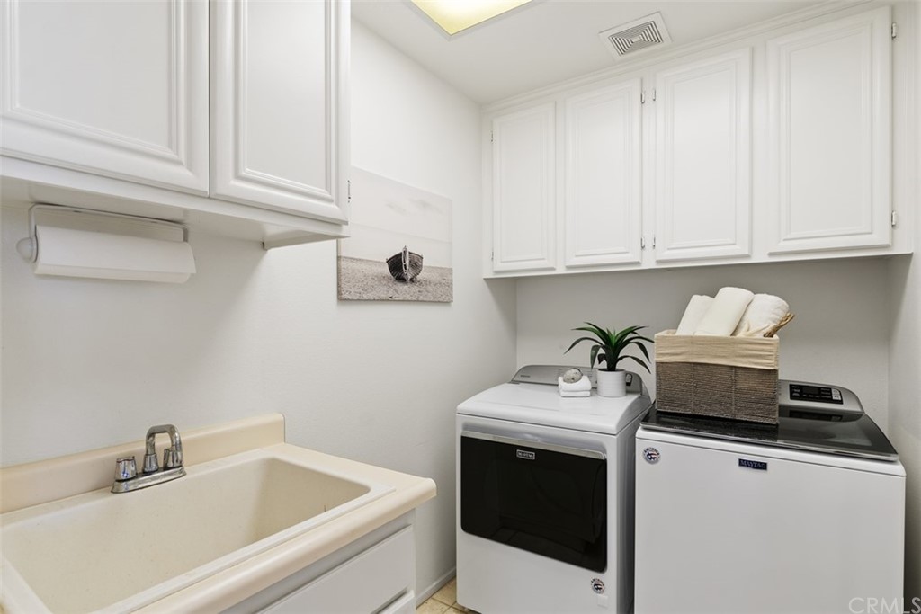 511 Avenida Ossa San Clemente, CA 92672 - Photo 31 of 49 a bathroom with a sink and cabinets