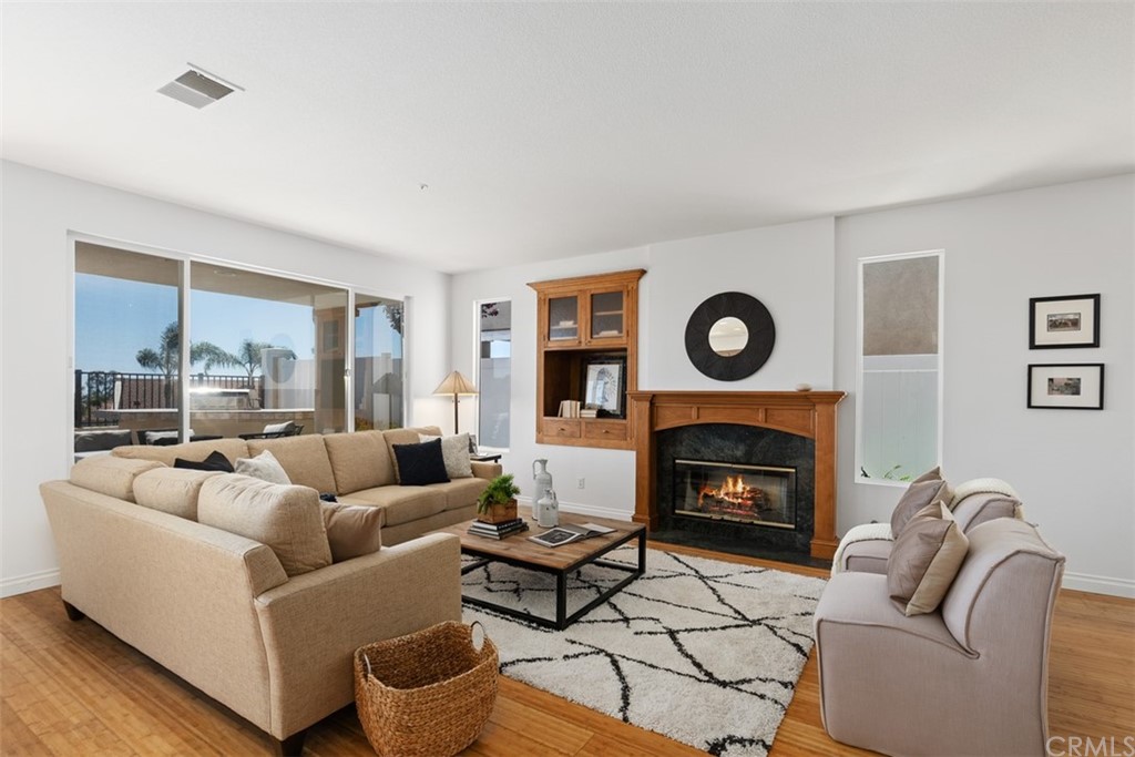 511 Avenida Ossa San Clemente, CA 92672 - Photo 9 of 49 a living room with furniture and a fireplace