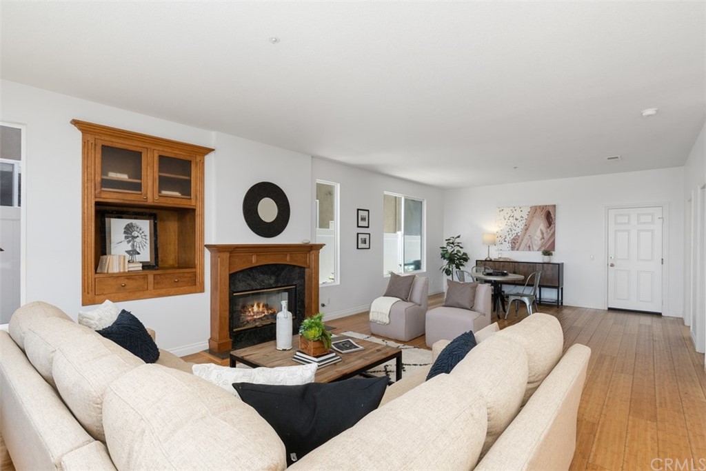 511 Avenida Ossa San Clemente, CA 92672 - Photo 10 of 49 a living room with furniture a fireplace and a fireplace