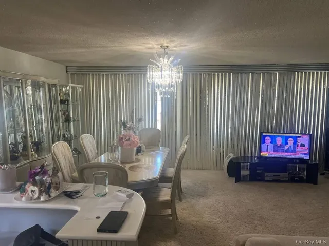 a view of a livingroom with furniture and window