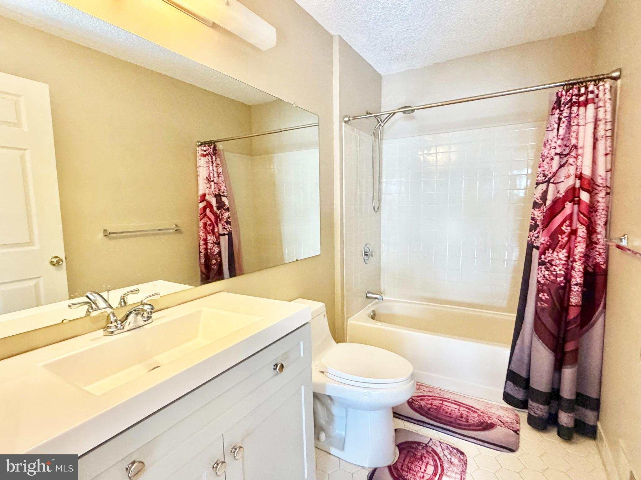 82 Versailles Court Hamilton, NJ 08619 - Photo 11 of 16 a bathroom with a sink toilet and shower