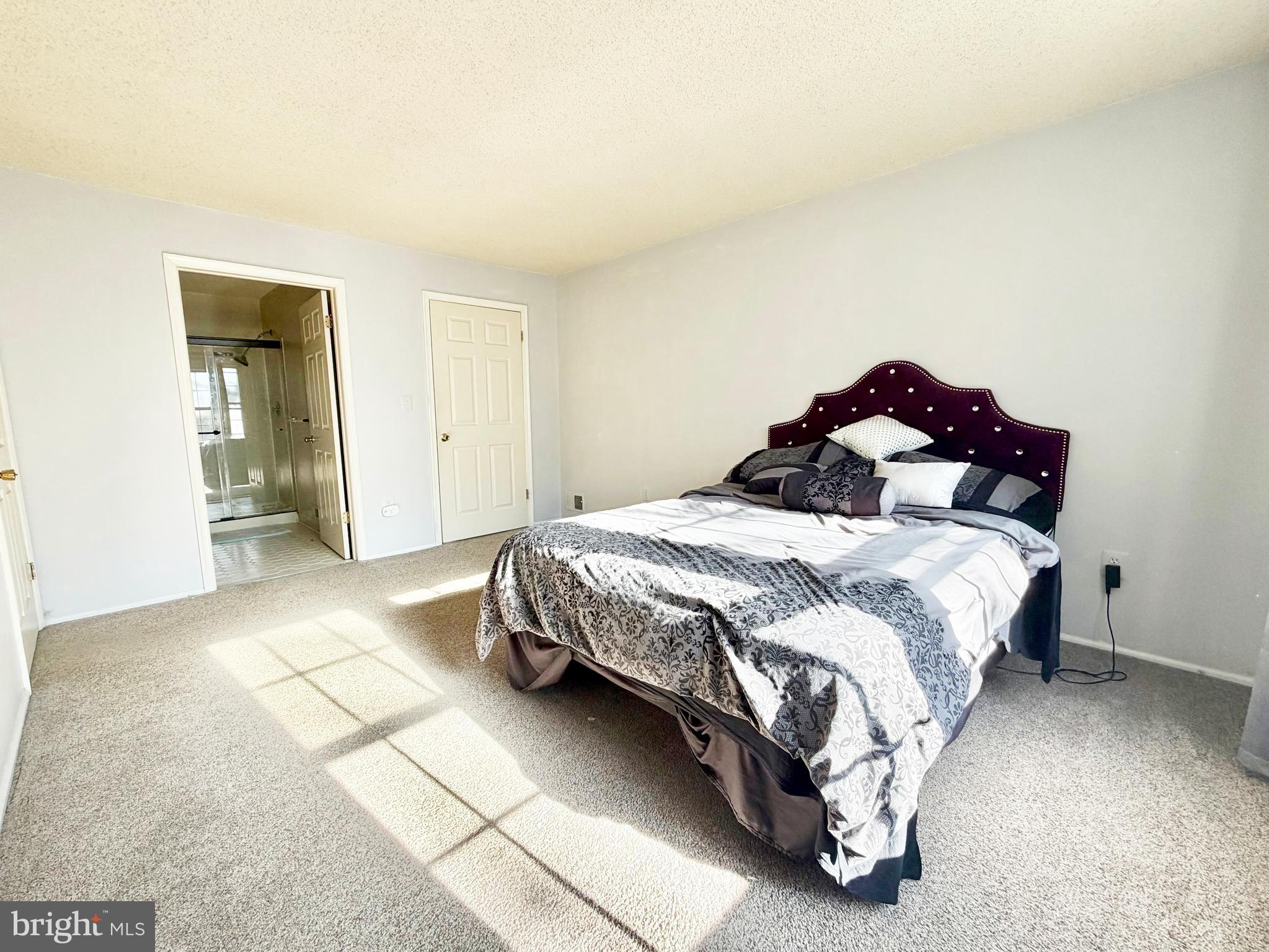 82 Versailles Court Hamilton, NJ 08619 - Photo 15 of 16 a bedroom with a bed and a painting