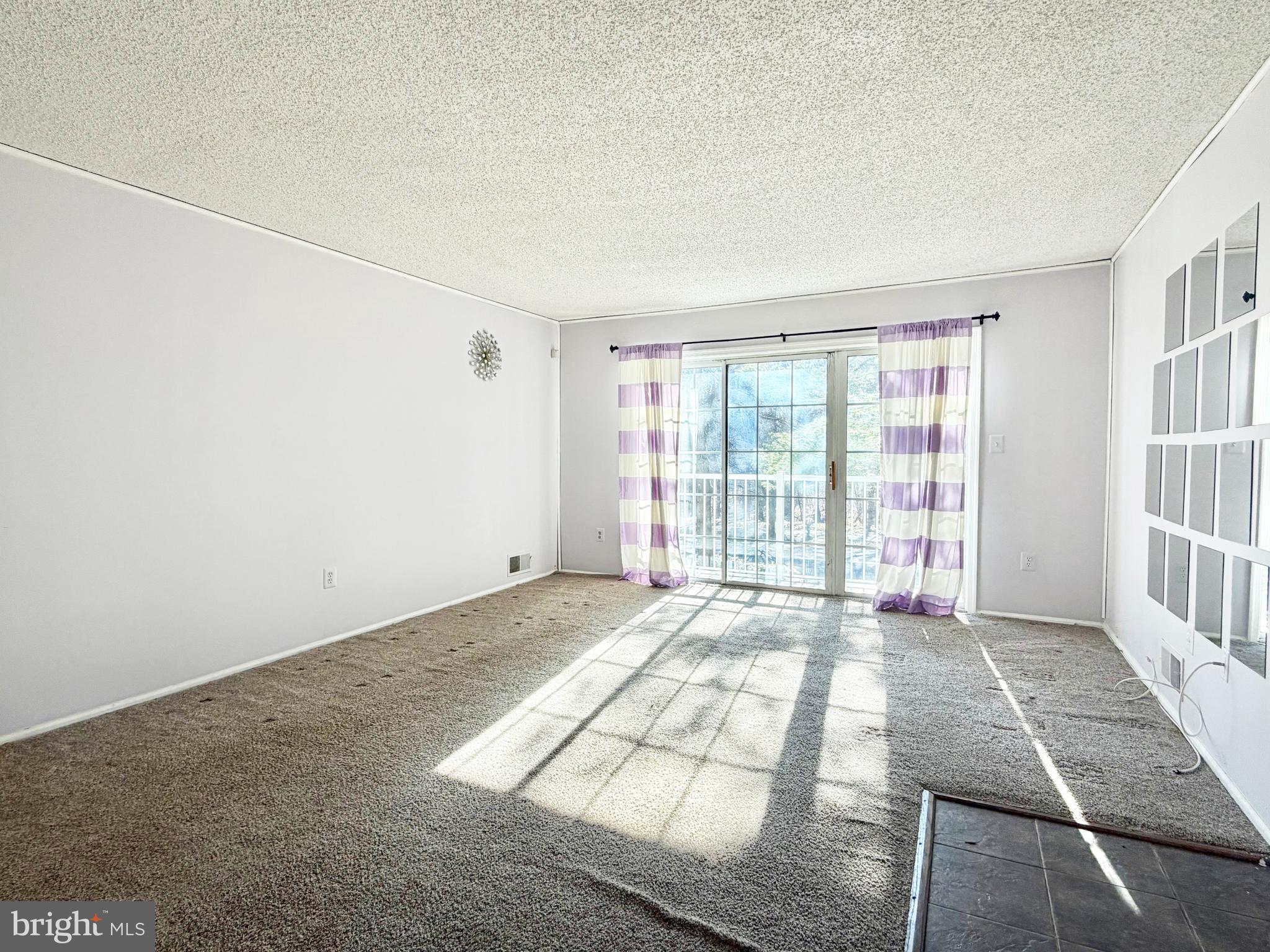 82 Versailles Court Hamilton, NJ 08619 - Photo 6 of 16 a view of an empty room with a window
