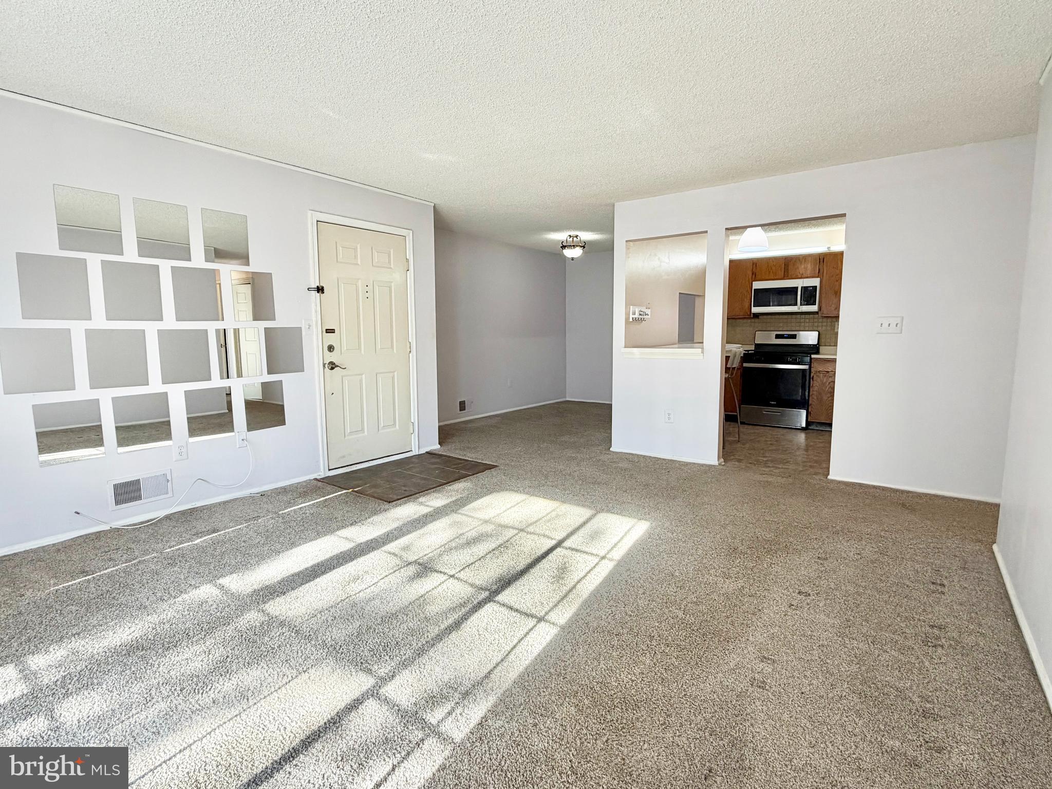 82 Versailles Court Hamilton, NJ 08619 - Photo 8 of 16 an empty room with windows