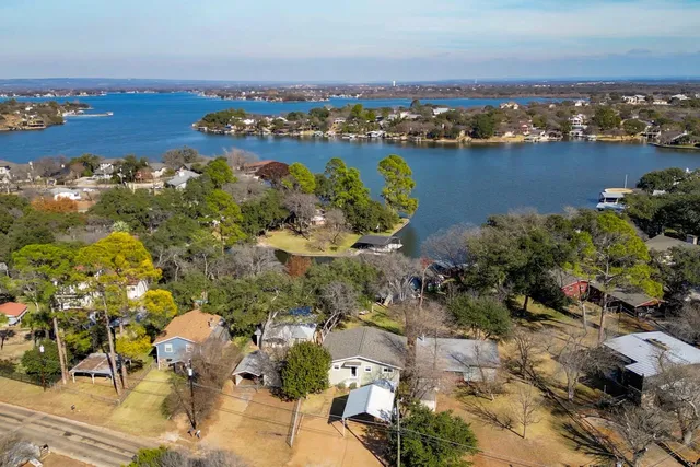 an aerial view of a houses with ocean view