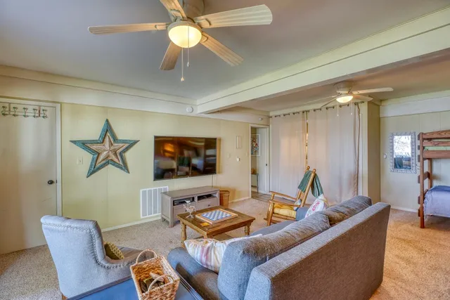a bathroom with a granite countertop sink a mirror and a shower