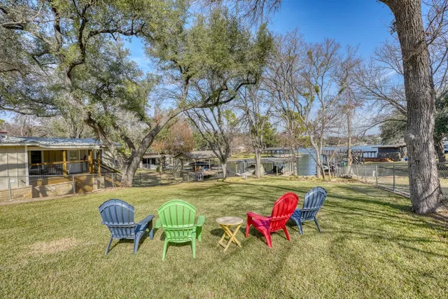 a view of a patio with a table and chairs
