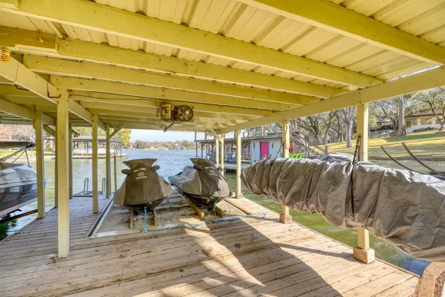 a view of a swimming pool with an outdoor seating and a lake view