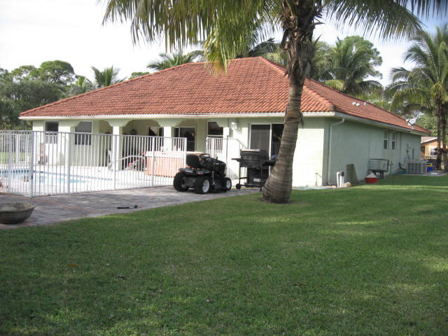 8896 Rodeo Drive Lake Worth, FL 33467 - Photo 1 of 29 FRONT