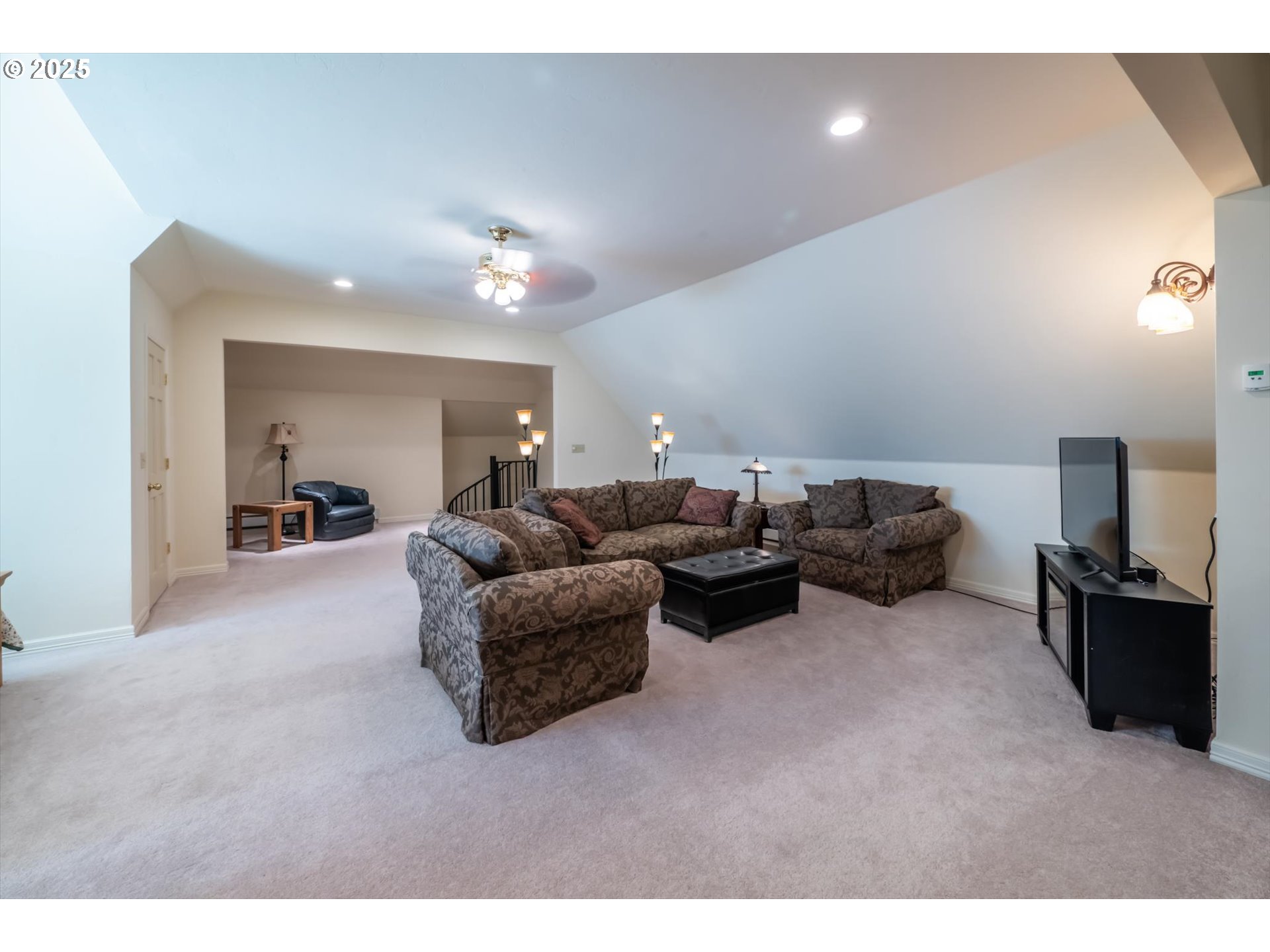 54983 Morrison Road Bandon, OR 97411 - Photo 7 of 29 a living room with furniture and a flat screen tv