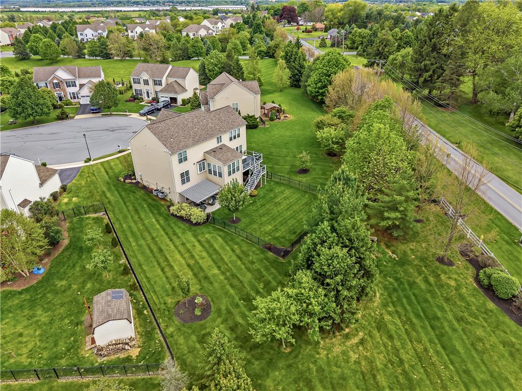 9031 Pathfinder Road Breinigsville, PA 18031 - Photo 59 of 63 An aerial perspective reveals a spacious residential yard with mature landscaping and clear boundaries.