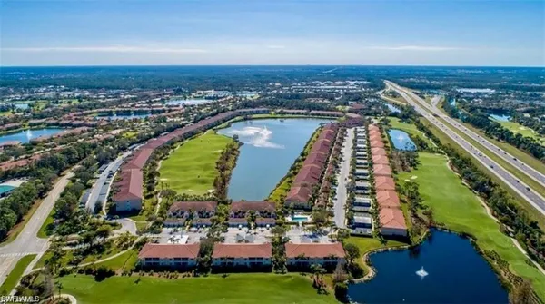 an aerial view of a city with lawn chairs