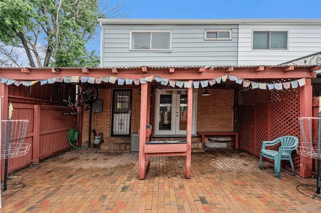 a view of a cafe with a table and chairs and wooden floor