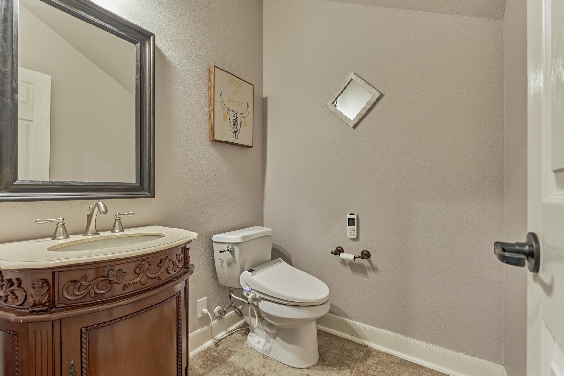 6615 Pelham Chase Drive Spring, TX 77389 - Photo 11 of 49 A half bath tucked under the staircase is an added convenience on the first floor.