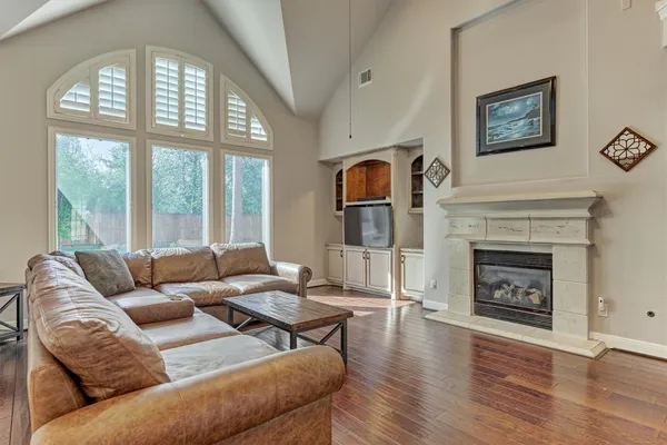 a living room with furniture and a fireplace