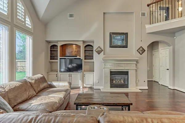 a living room with furniture and a fireplace