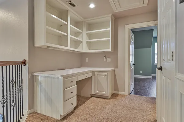 a view of cabinets and utility room with washer and dryer