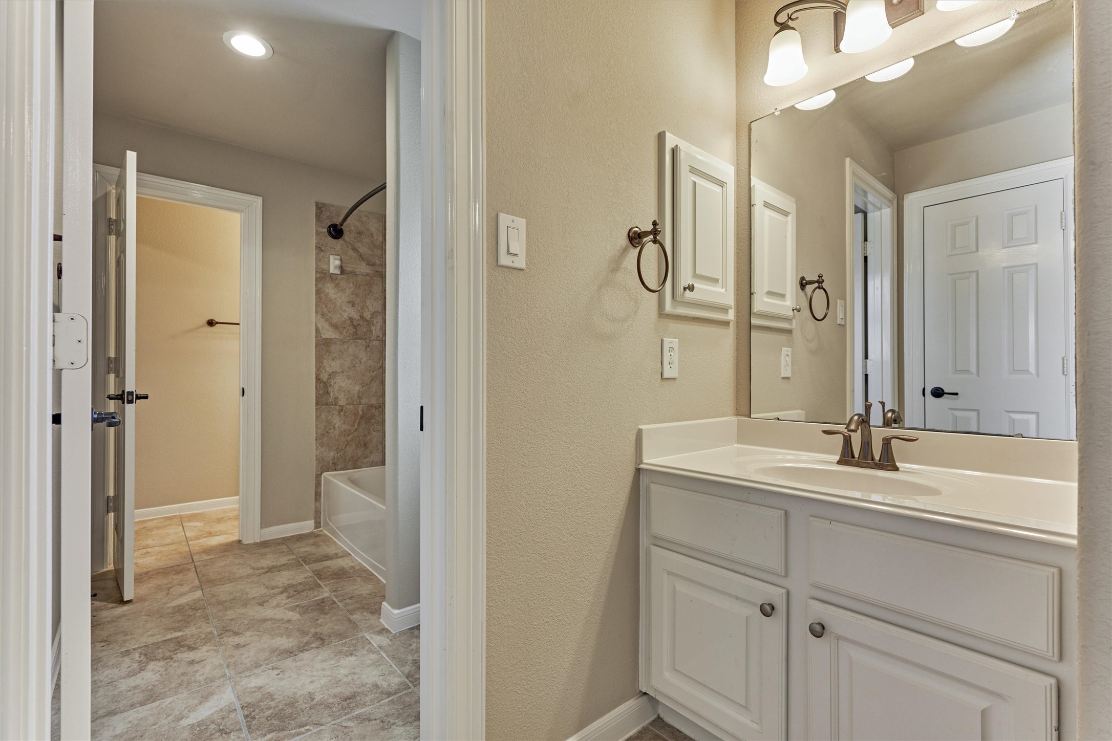 6615 Pelham Chase Drive Spring, TX 77389 - Photo 34 of 49 The bathroom features a private sink area for each bedroom with a shared tub and toilet area.