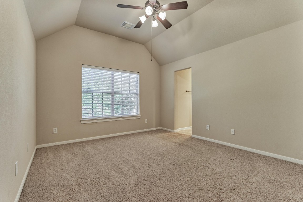 6615 Pelham Chase Drive Spring, TX 77389 - Photo 35 of 49 The fourth bedroom is upstairs and features neutral finishes, a vaulted ceiling, a window overlooking the front yard and a private sink area that connects to the shared Jack and Jill style bath.