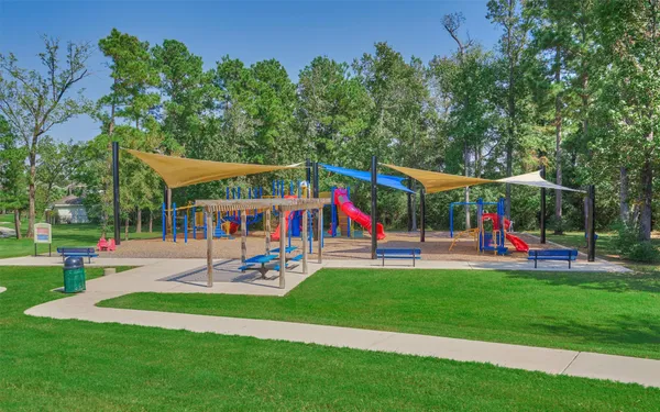 a view of a park with a building in the back
