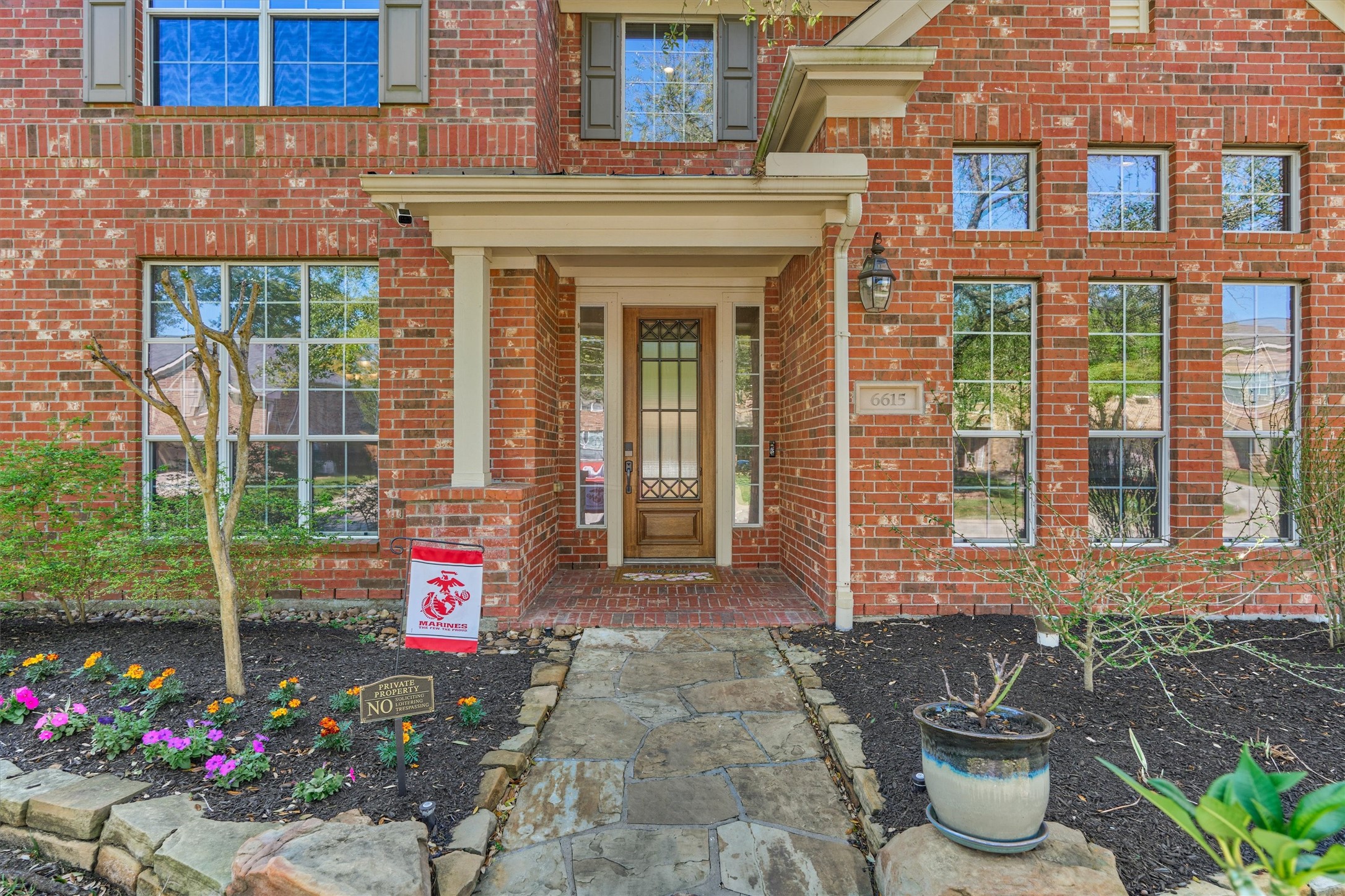 6615 Pelham Chase Drive Spring, TX 77389 - Photo 5 of 49 A covered front entry welcomes with a stained wood door accented by sidelights.