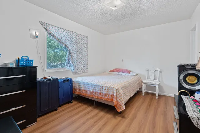 a bedroom with a bed and a closet