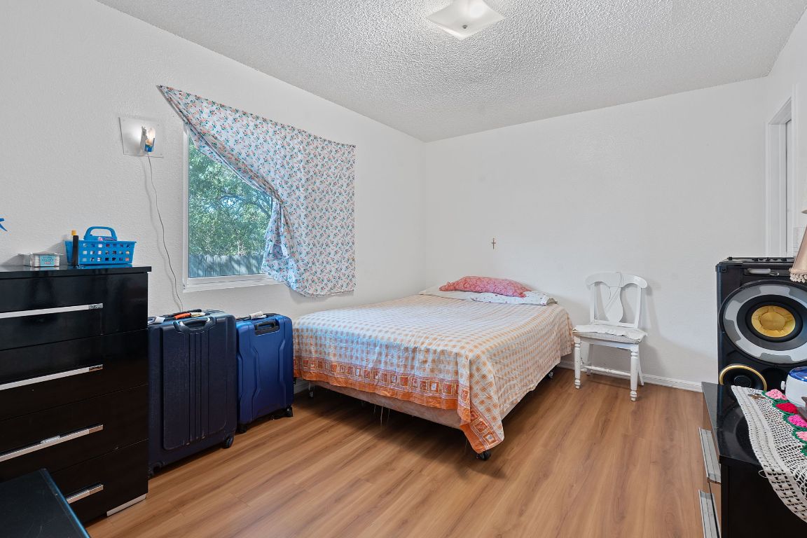 1105 Quail Valley Drive Georgetown, TX 78626 - Photo 13 of 38 a bedroom with a bed and a closet