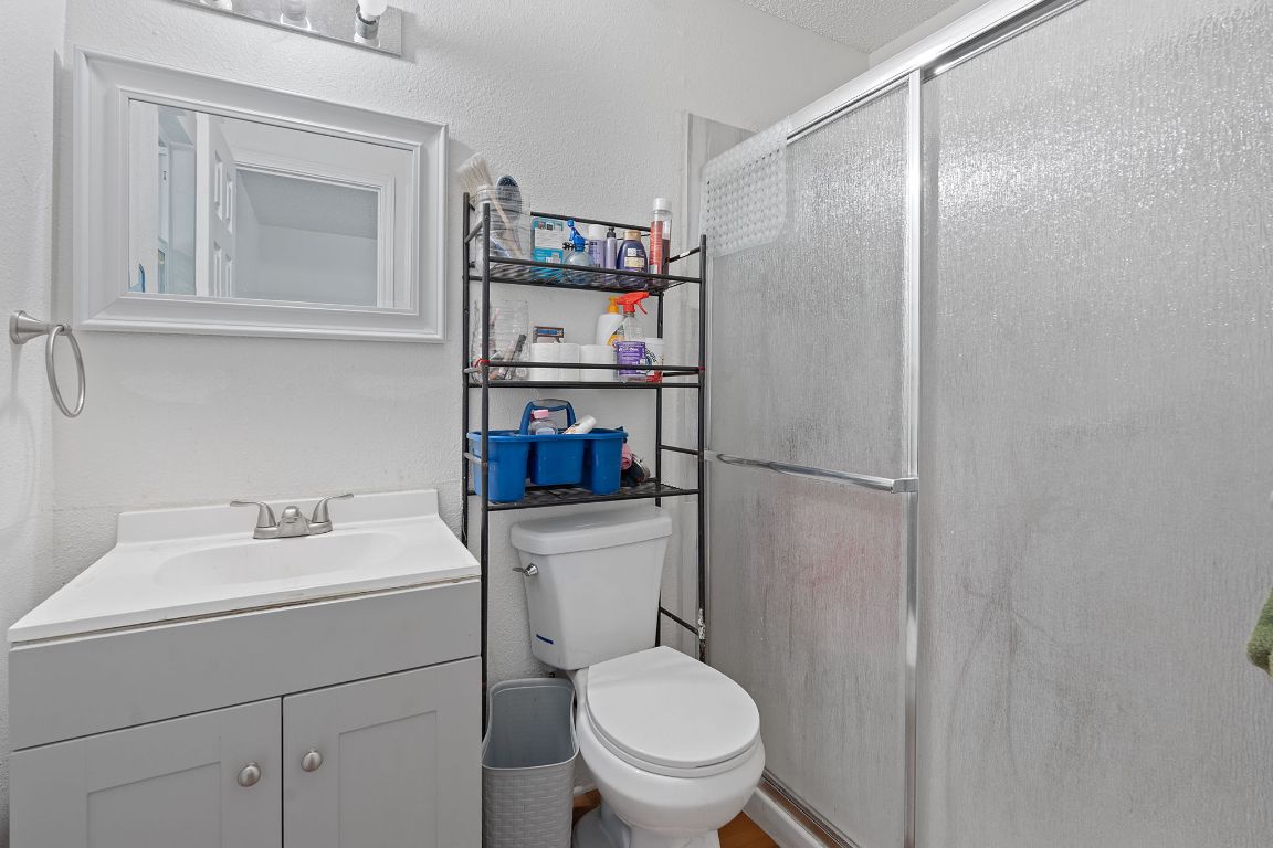 1105 Quail Valley Drive Georgetown, TX 78626 - Photo 15 of 38 a bathroom with a toilet sink and shower