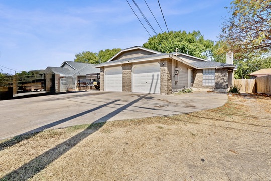 1105 Quail Valley Drive Georgetown, TX 78626 - Photo 2 of 38 a house with yard in front of it