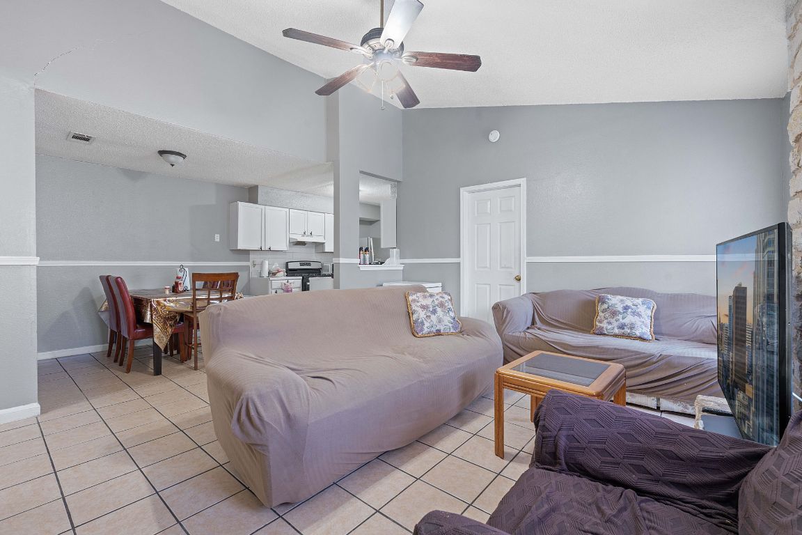1105 Quail Valley Drive Georgetown, TX 78626 - Photo 23 of 38 a living room with furniture and a table