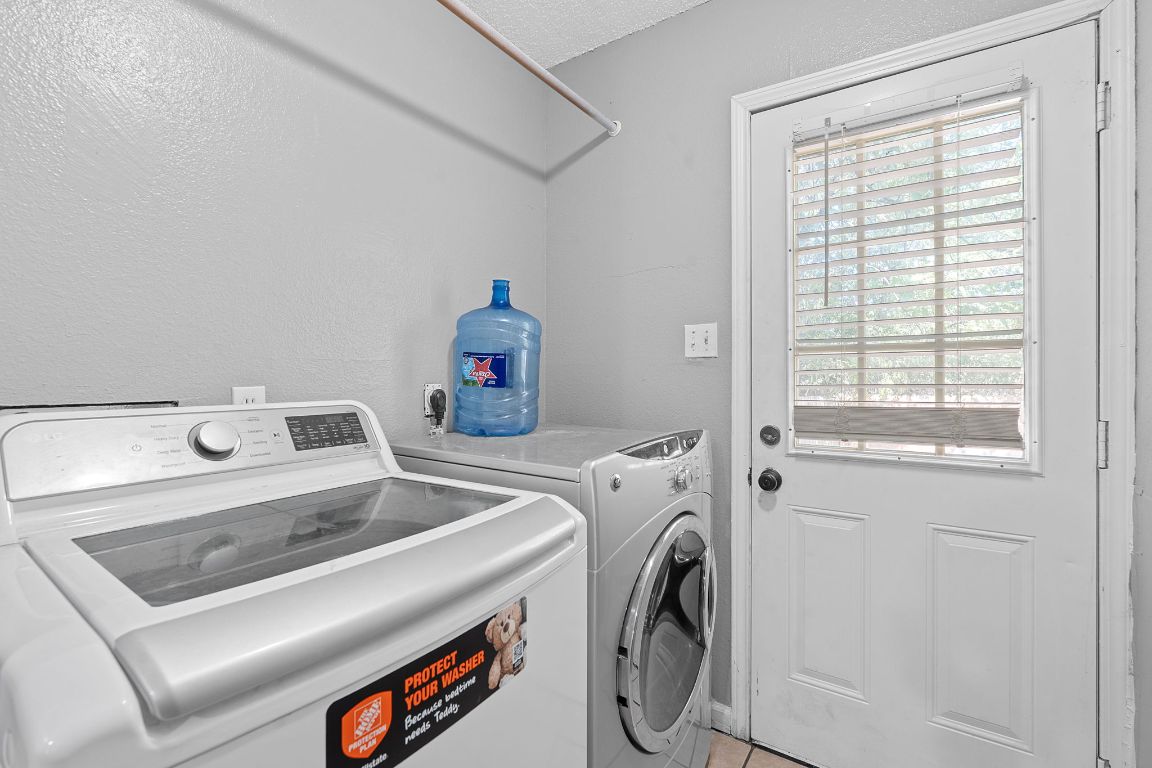 1105 Quail Valley Drive Georgetown, TX 78626 - Photo 30 of 38 a utility room with dryer and washer