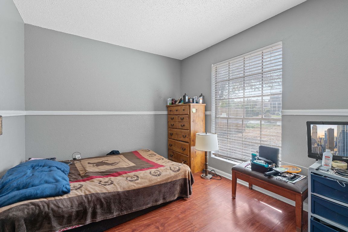 1105 Quail Valley Drive Georgetown, TX 78626 - Photo 31 of 38 a bedroom with a bed and a desk