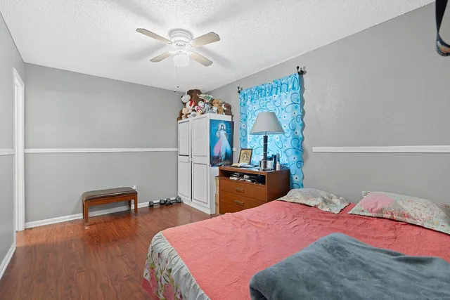 a bathroom with a toilet sink vanity tub and shower