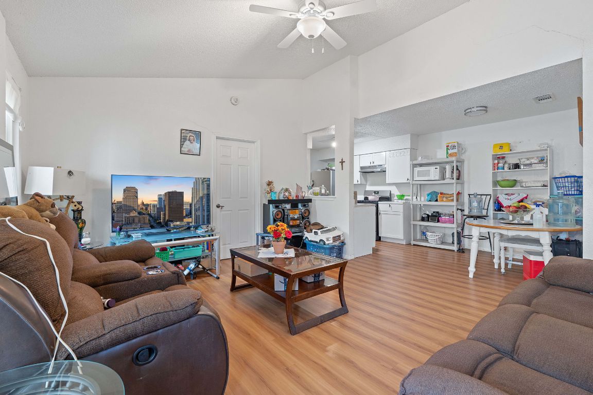 1105 Quail Valley Drive Georgetown, TX 78626 - Photo 8 of 38 a living room with furniture and a flat screen tv