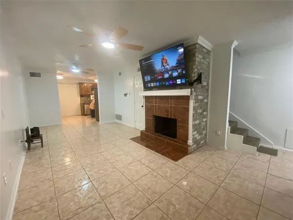 a view of a livingroom with furniture and a fireplace