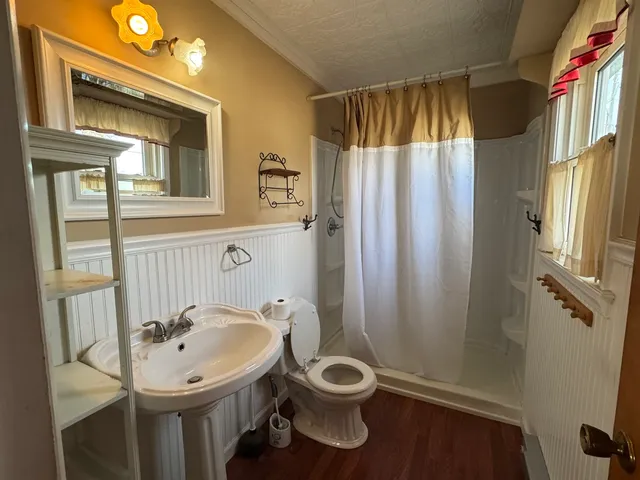 a view of an entryway with wooden floor