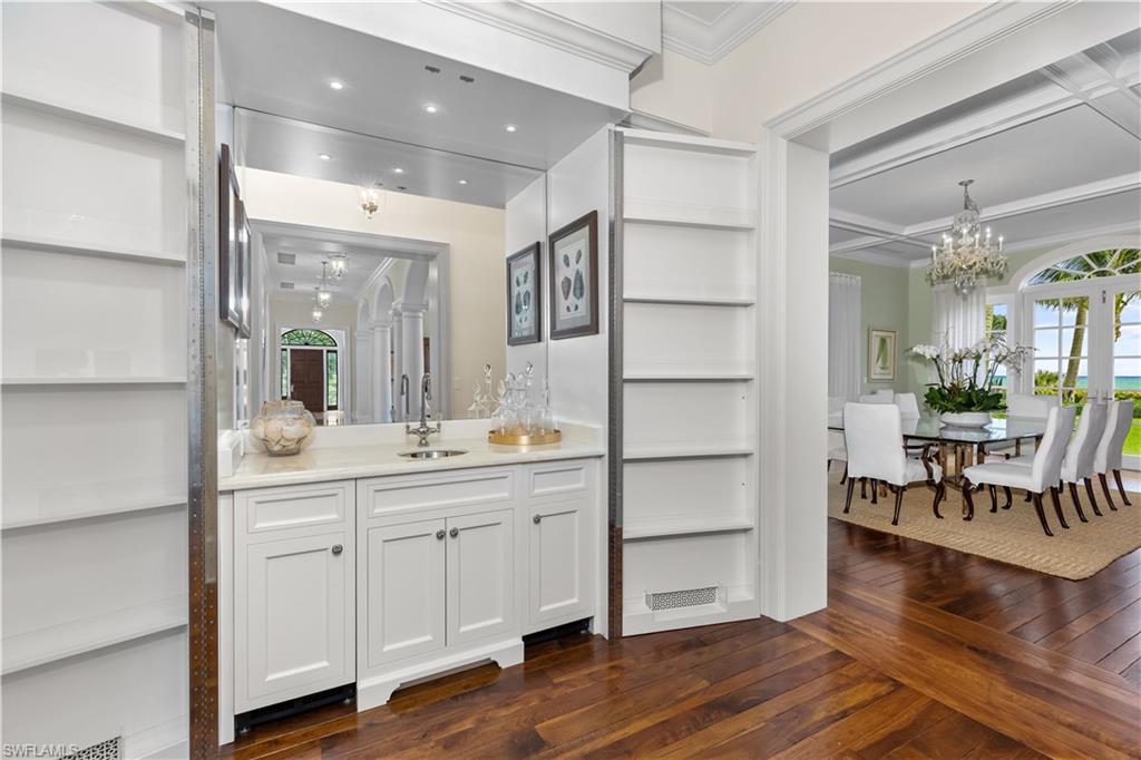 475 South Beach Road Hobe Sound, FL 33455 - Photo 25 of 49 a hall with cabinets and wooden floor