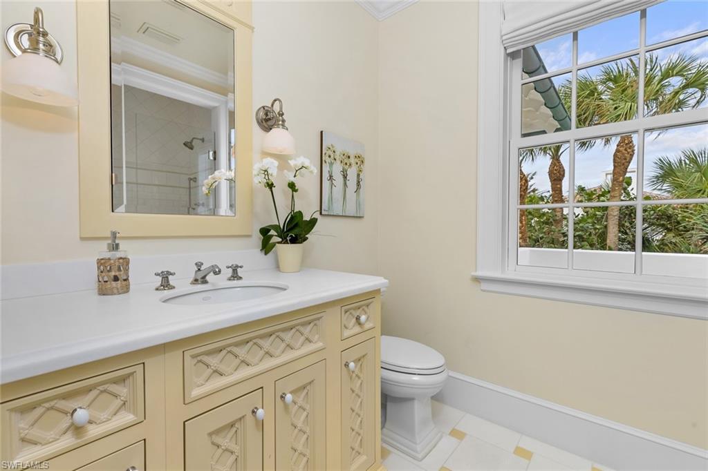 475 South Beach Road Hobe Sound, FL 33455 - Photo 45 of 49 a bathroom with a granite countertop sink mirror and a toilet