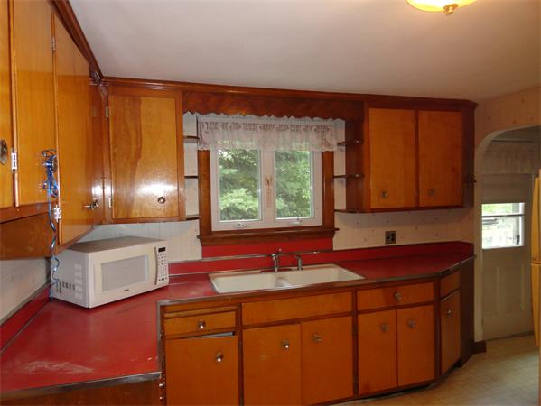 23 Spring Lane Stoneham, MA 02180 - Photo 8 of 8 a bathroom with a sink double vanity and a mirror