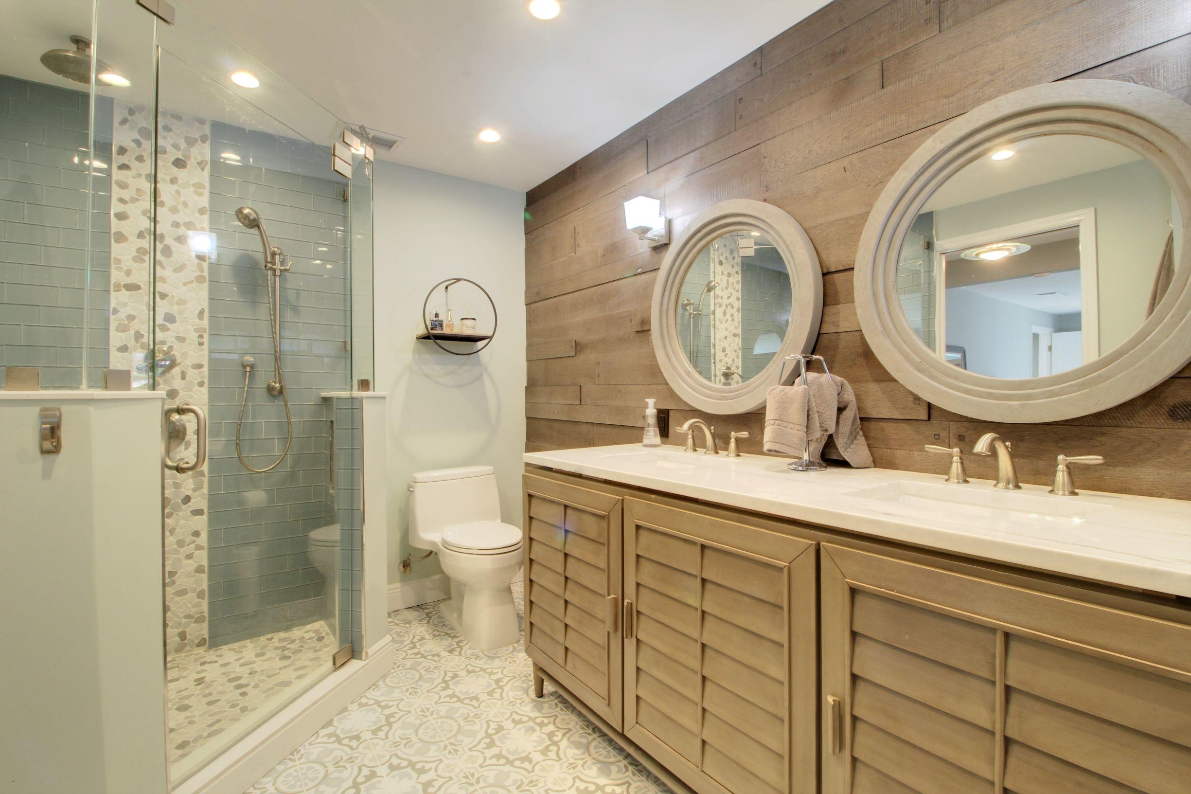 1501 Banyan Road Boca Raton, FL 33432 - Photo 22 of 26 a bathroom with a granite countertop double vanity sink mirror and shower