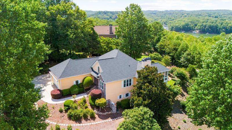 an aerial view of a house with yard swimming pool and outdoor seating