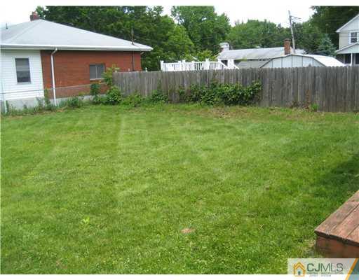 1984 Oak Tree Road Edison, NJ 08820 - Photo 22 of 25 a view of a house with backyard and garden
