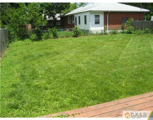 1984 Oak Tree Road Edison, NJ 08820 - Photo 23 of 25 a backyard of a house with plants and garden