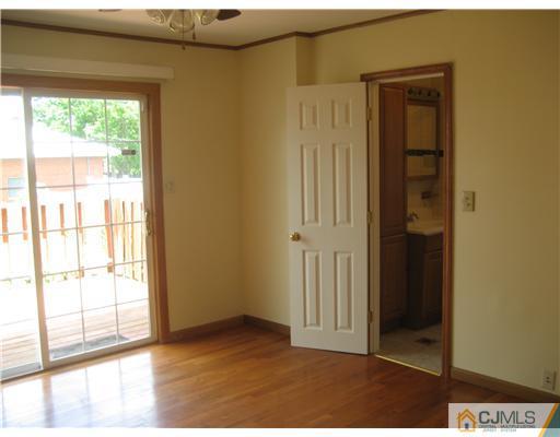 1984 Oak Tree Road Edison, NJ 08820 - Photo 6 of 25 a view of an empty room with a window