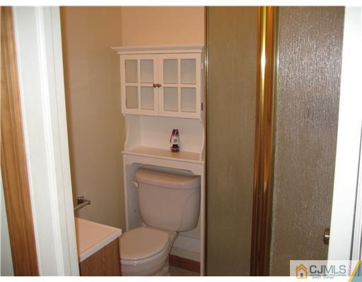 1984 Oak Tree Road Edison, NJ 08820 - Photo 10 of 25 a bathroom with a sink and a toilet