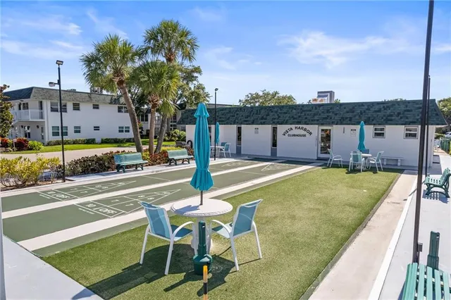 a view of a lake with houses in the back