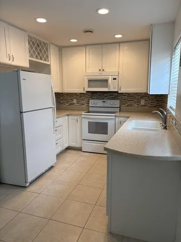 a bathroom with a glass door shower